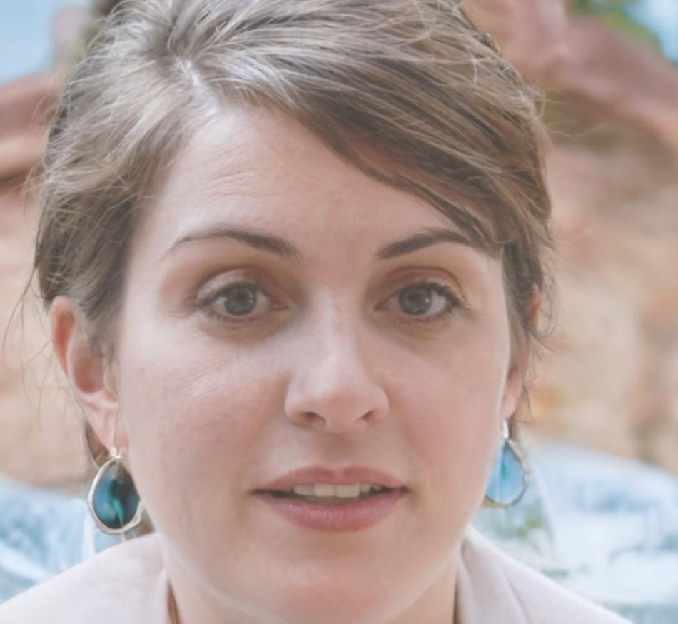Professional headshot of Elena, game designer and entrepreneur